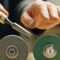 Which type of grinding wheel is more economical for hand tool sharpening?